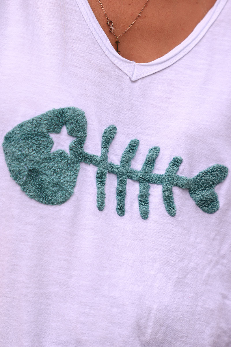 White cotton t-shirt with celadon green fish design in boucle