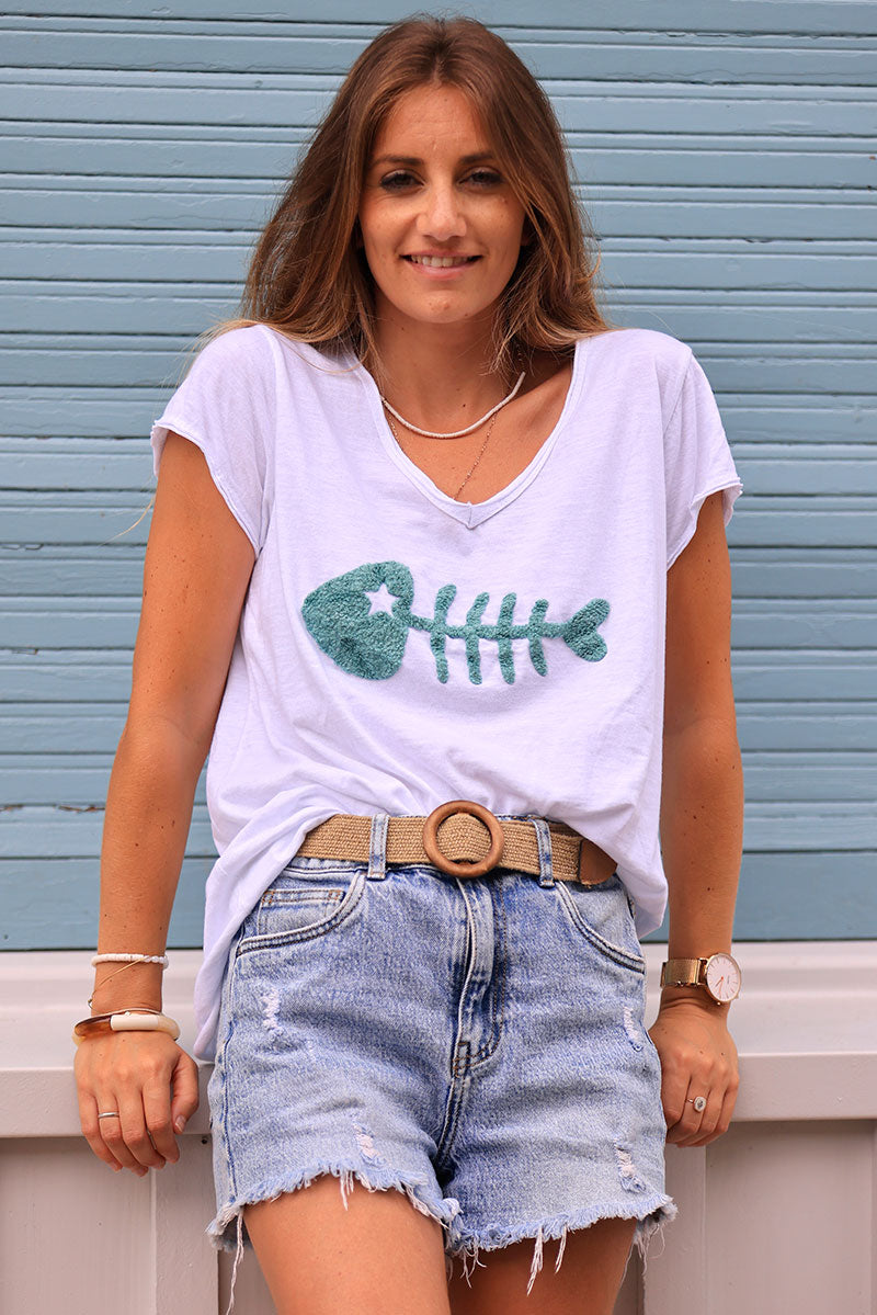 White cotton t-shirt with celadon green fish design in boucle