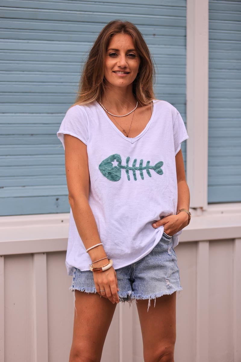 White cotton t-shirt with celadon green fish design in boucle