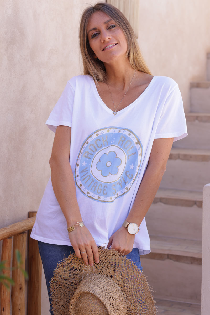 White t-shirt with blue and gold rock and roll daisy logo