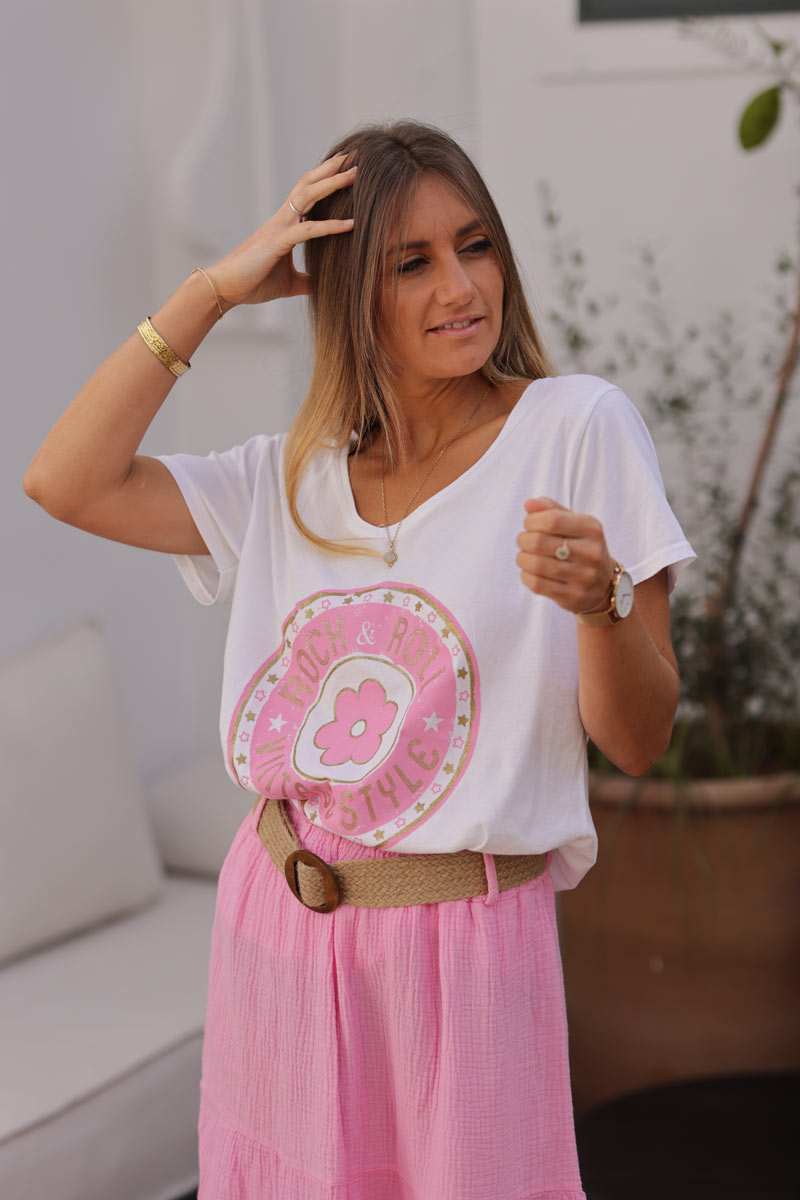 White t-shirt with pink and gold rock and roll daisy logo