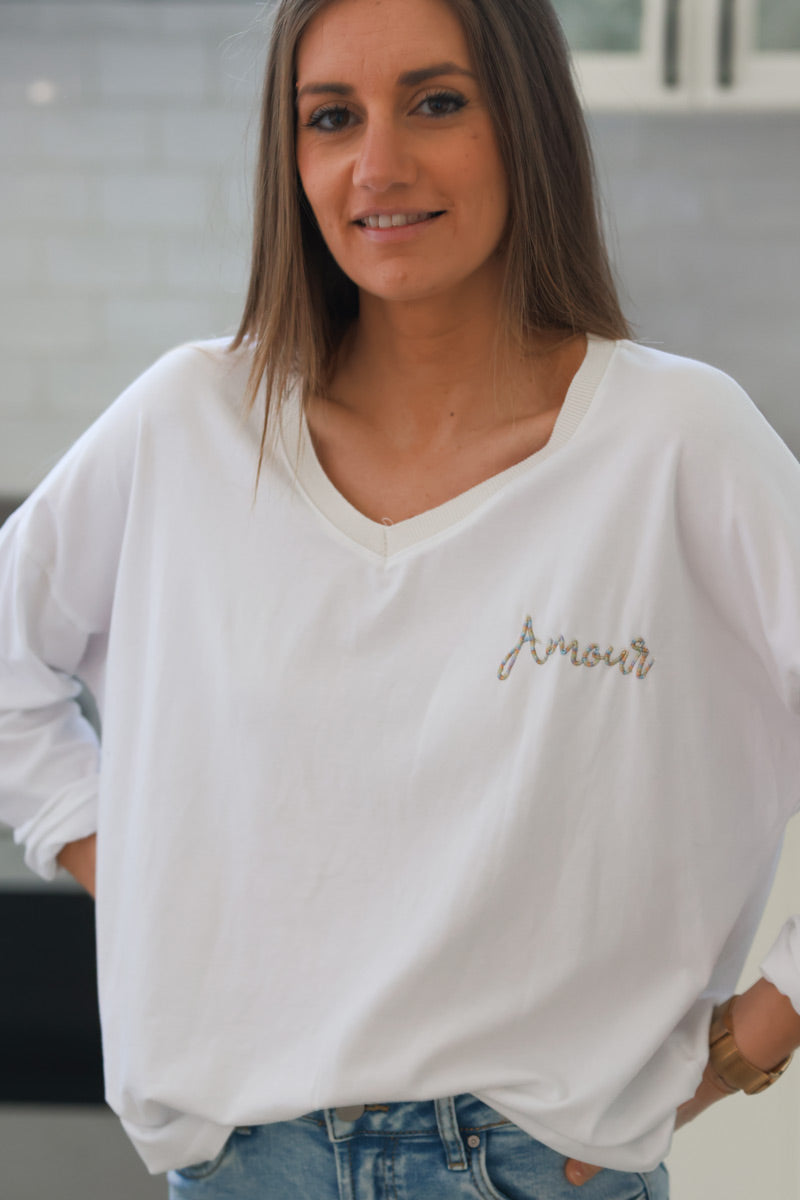 Camiseta de algodón blanca de manga larga con bordado Love con hilos de colores y escote en pico