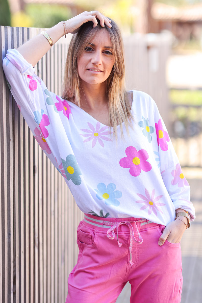 White cotton long sleeve top with colourful flowers
