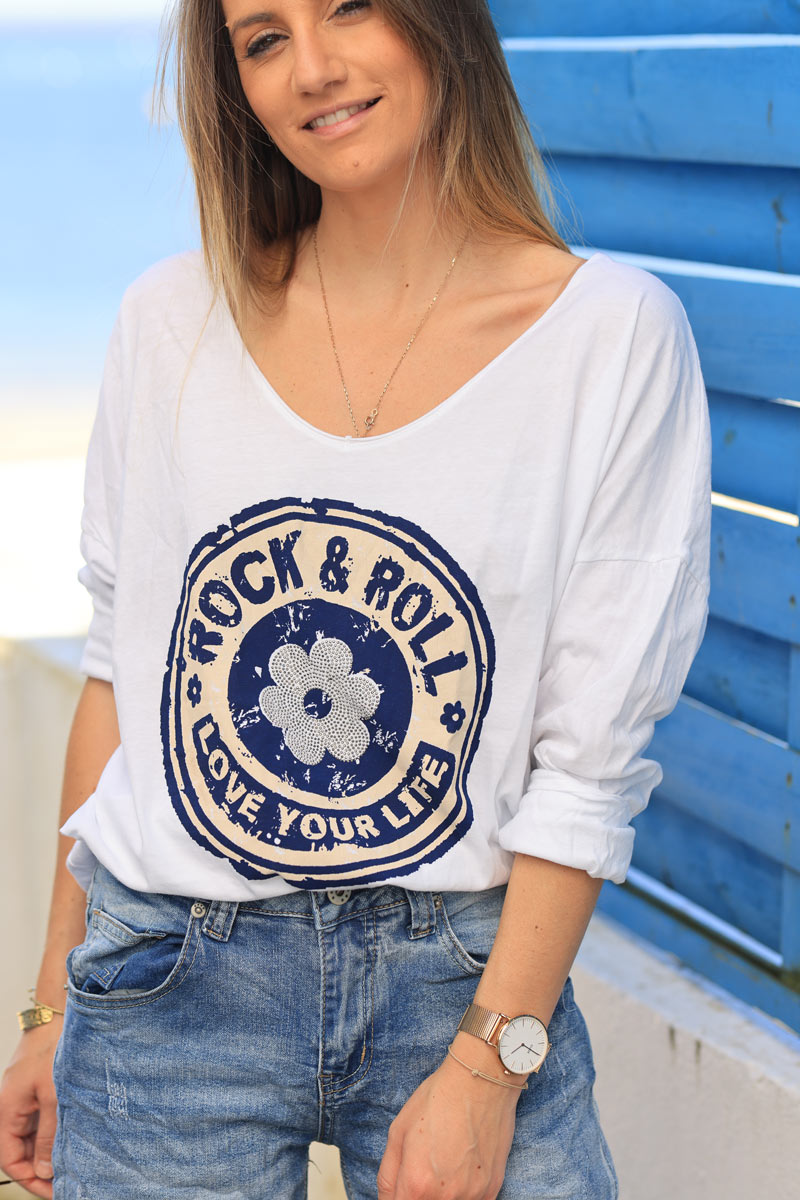 White cotton long sleeve top with navy blue rock and roll flower print