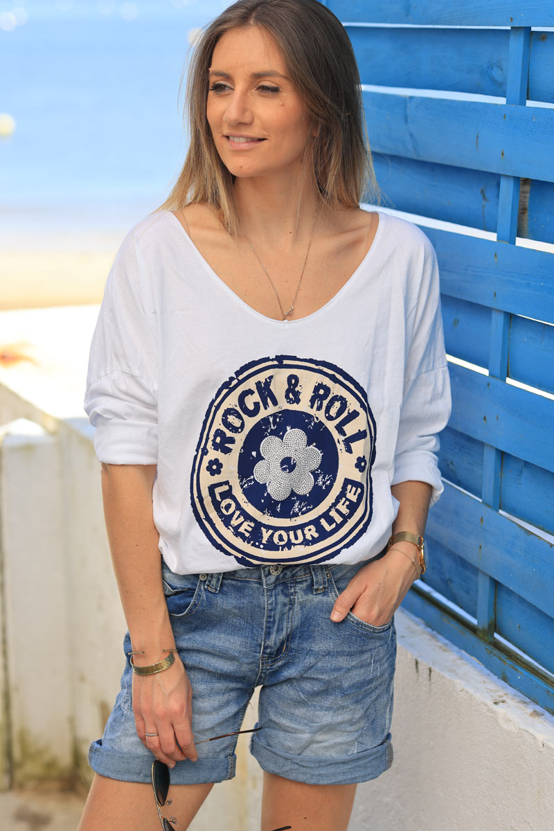 White cotton long sleeve top with navy blue rock and roll flower print
