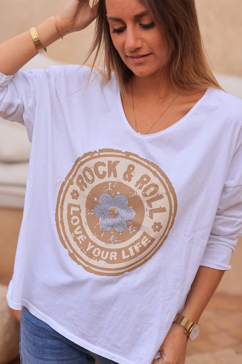 White cotton long sleeve top with camel rock and roll flower print