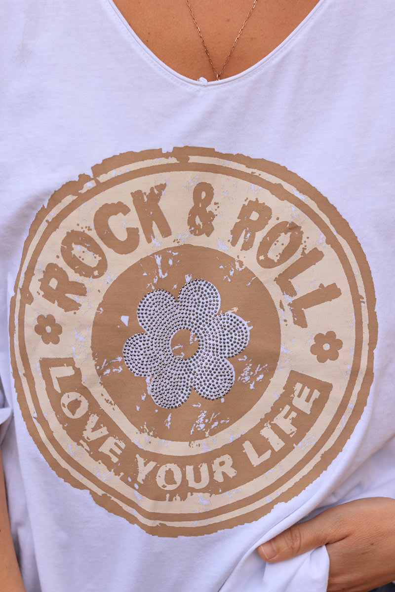 White cotton long sleeve top with camel rock and roll flower print