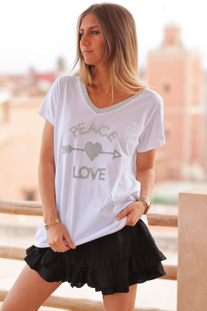 White cotton t-shirt with glitter arrow and 'PEACE' in boucle