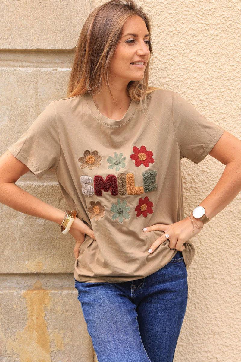 Camel loose t-shirt with colorful ‘SMILE’ and flowers in boucle