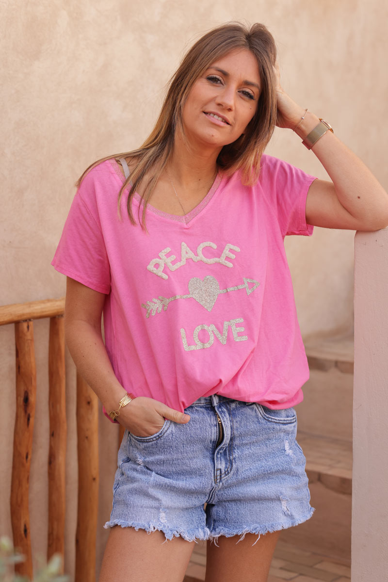 Fuchsia cotton t-shirt with glitter arrow and 'PEACE' in boucle