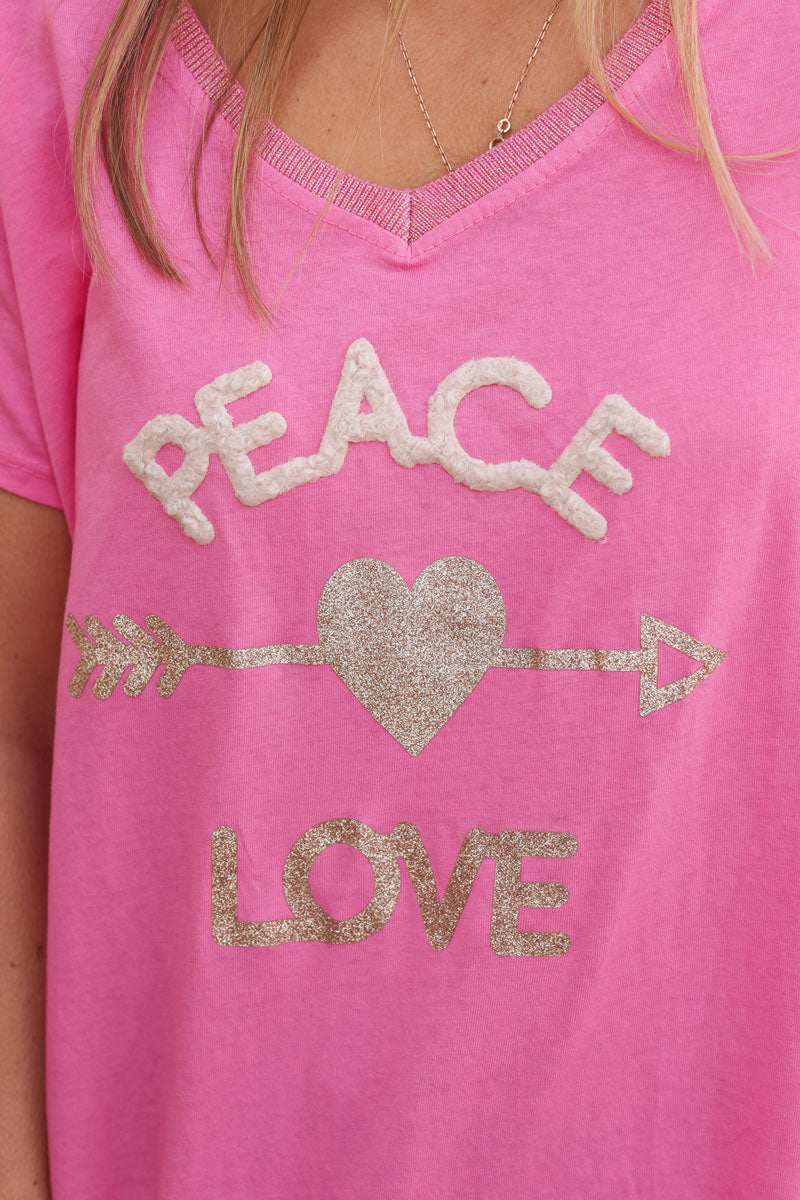 Fuchsia cotton t-shirt with glitter arrow and 'PEACE' in boucle