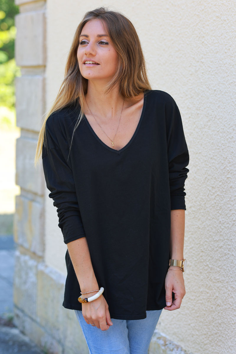 Black long sleeve top with embroidered back patch