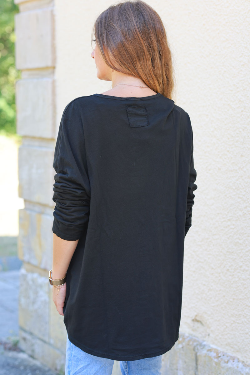 Black long sleeve top with embroidered back patch