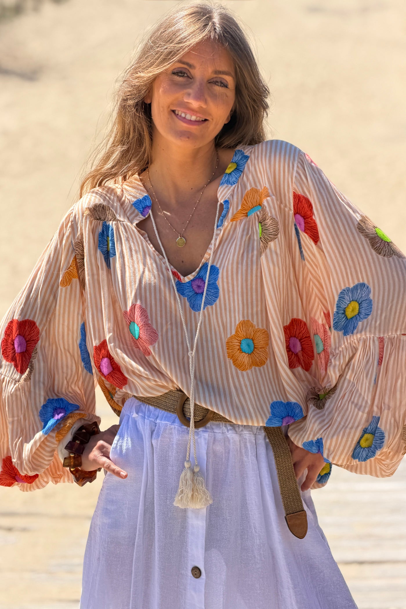 Floaty semi-sheer blouse with orange stripes and colourful flower print
