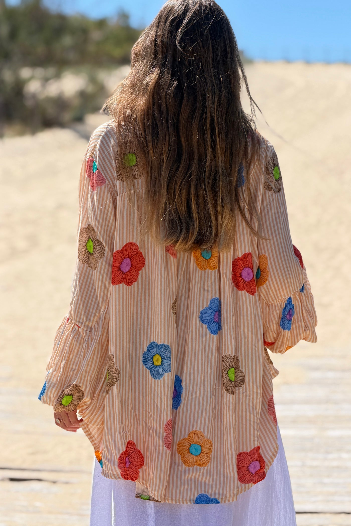 Floaty semi-sheer blouse with orange stripes and colourful flower print