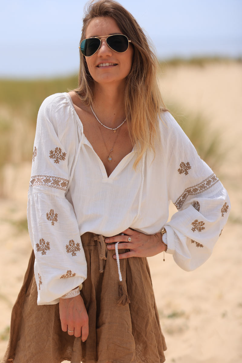 Off white blouse with camel embroidery and tassel ties