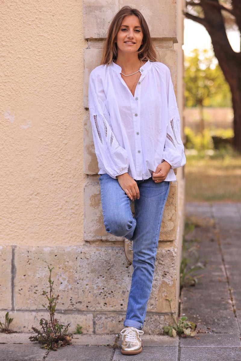 White blouse with open crochet sleeves