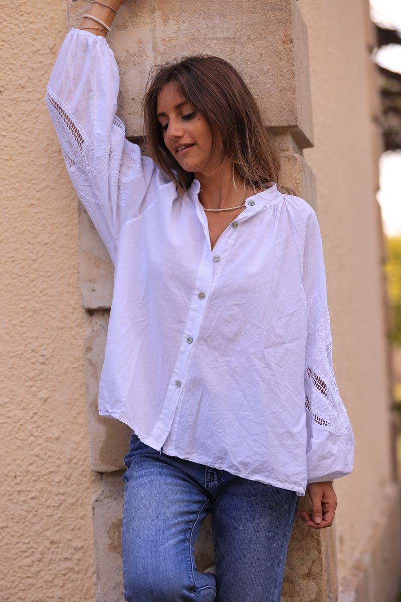 White blouse with open crochet sleeves