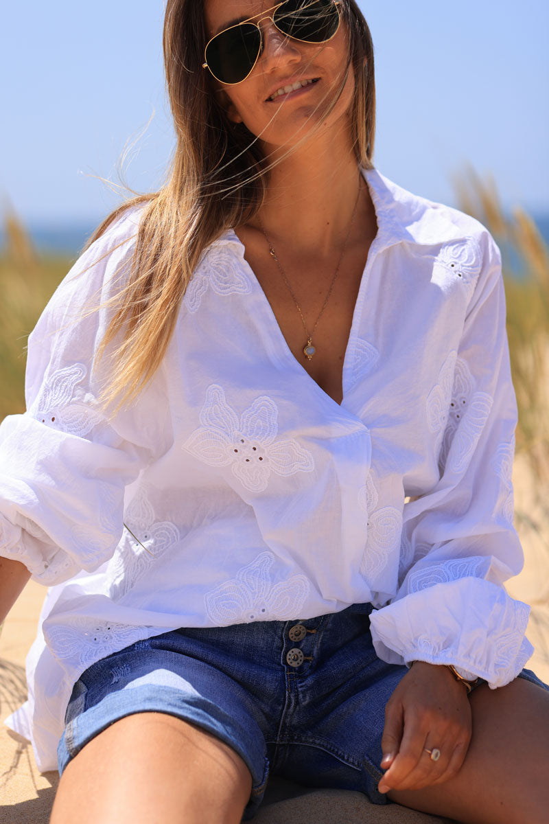 White v-neck blouse with flower embroidery