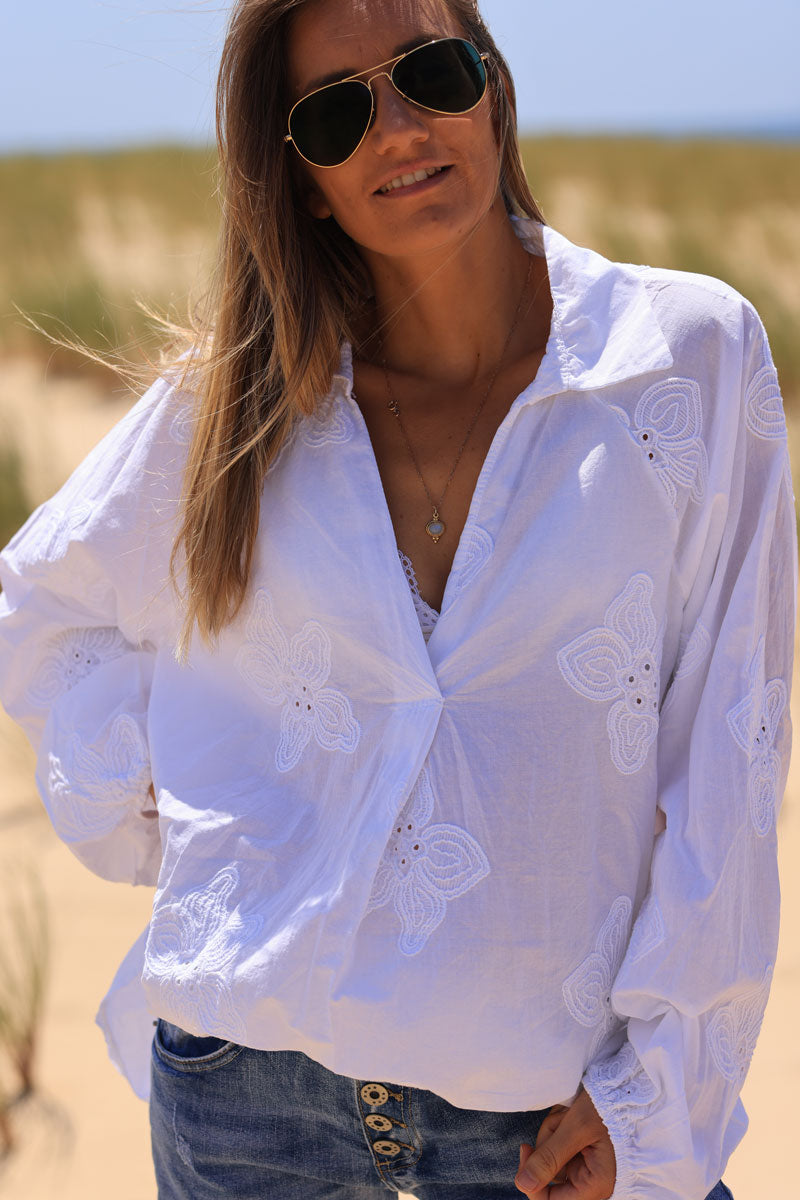 White v-neck blouse with flower embroidery