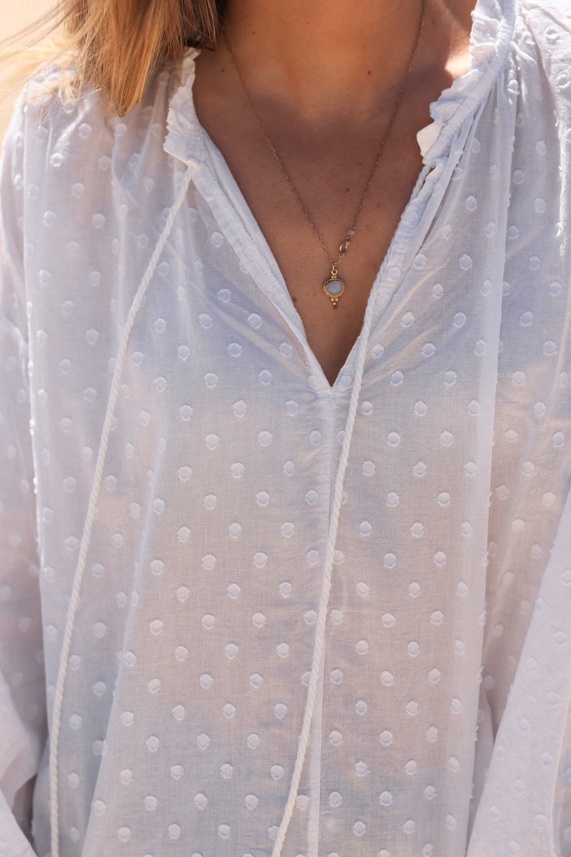 White polka dot embroidered cotton blouse with tassel ties