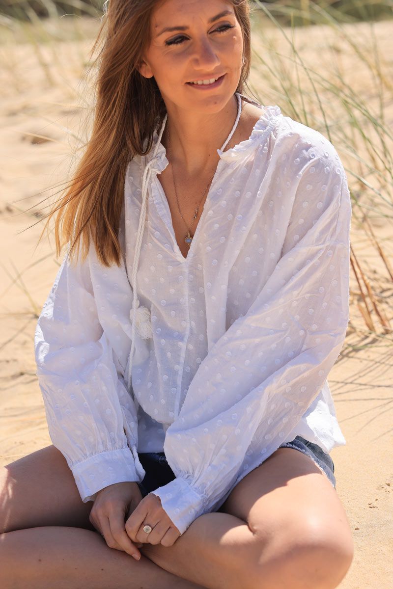 White polka dot embroidered cotton blouse with tassel ties