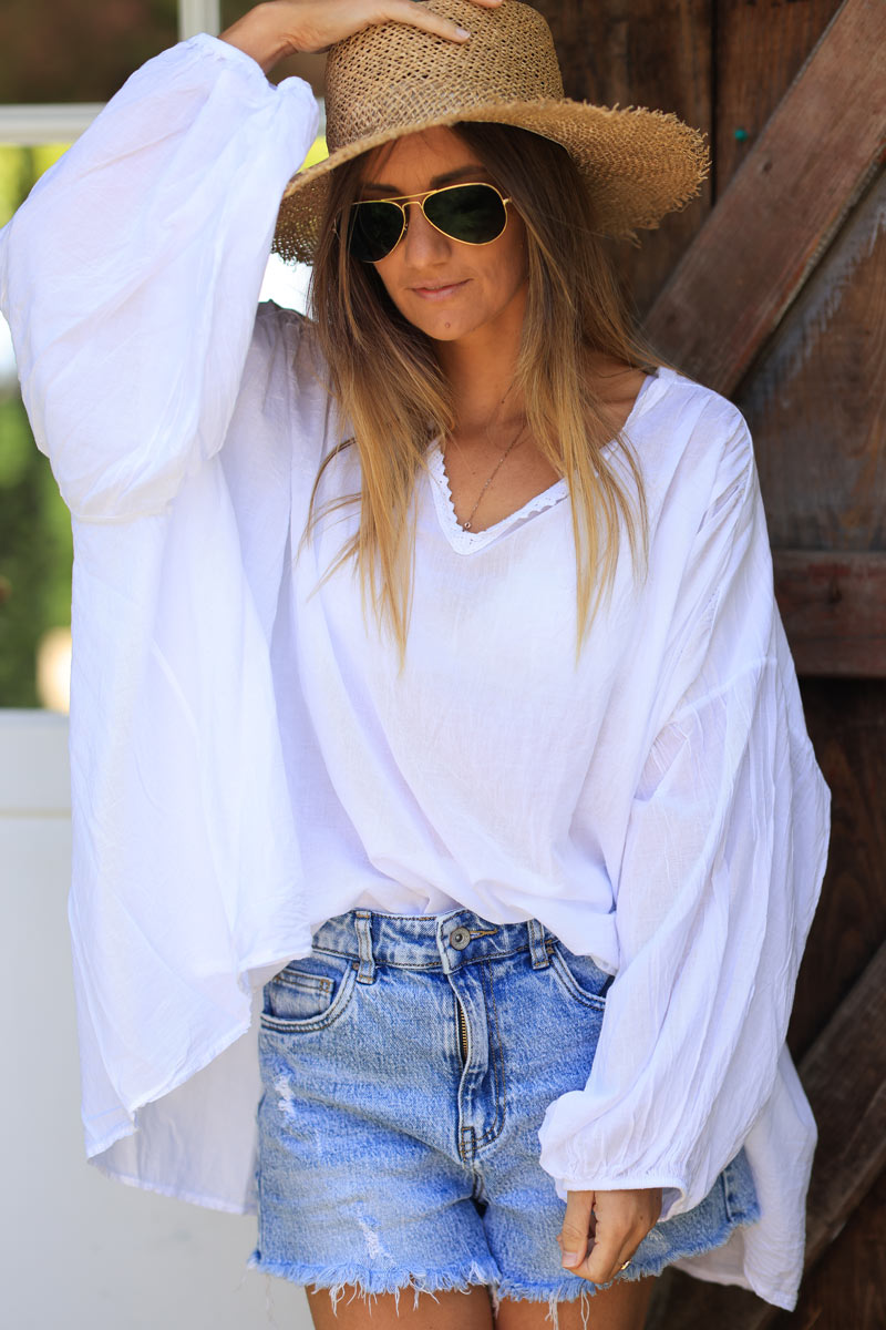 White oversized cotton v-neck blouse with embroidery detail