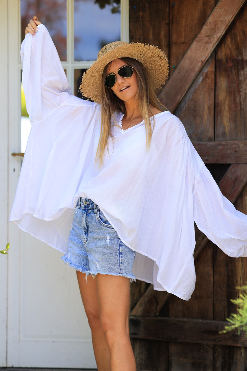 White oversized cotton v-neck blouse with embroidery detail