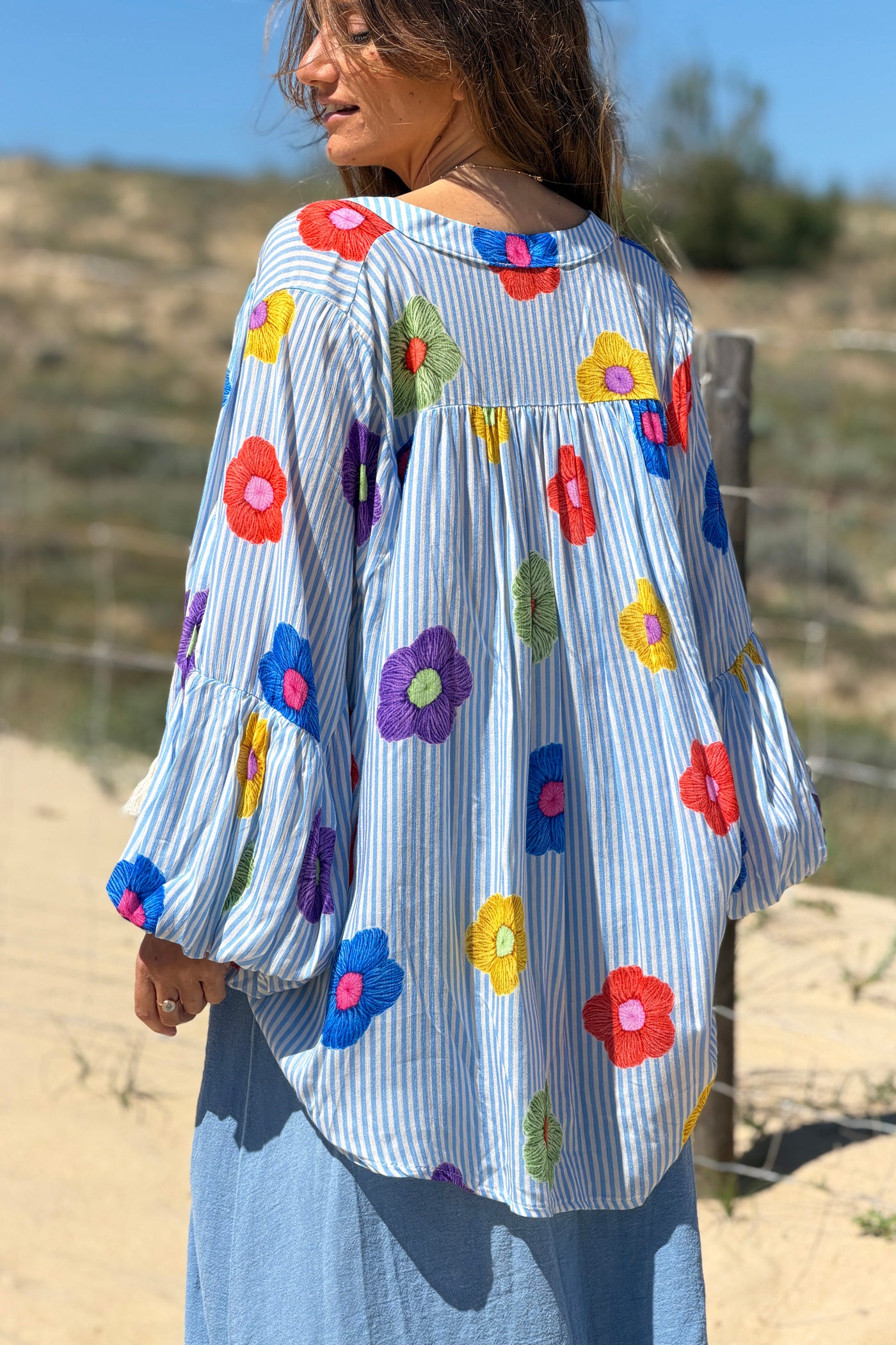 Floaty semi-sheer blouse with blue stripes and colourful flower print