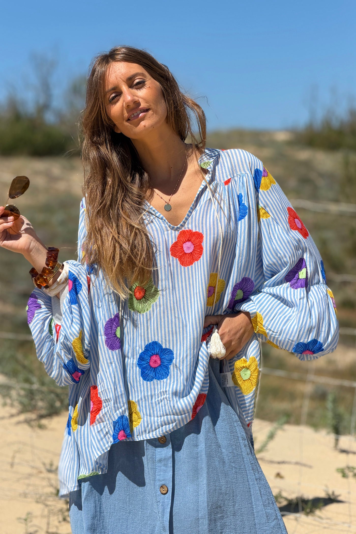 Floaty semi-sheer blouse with blue stripes and colourful flower print