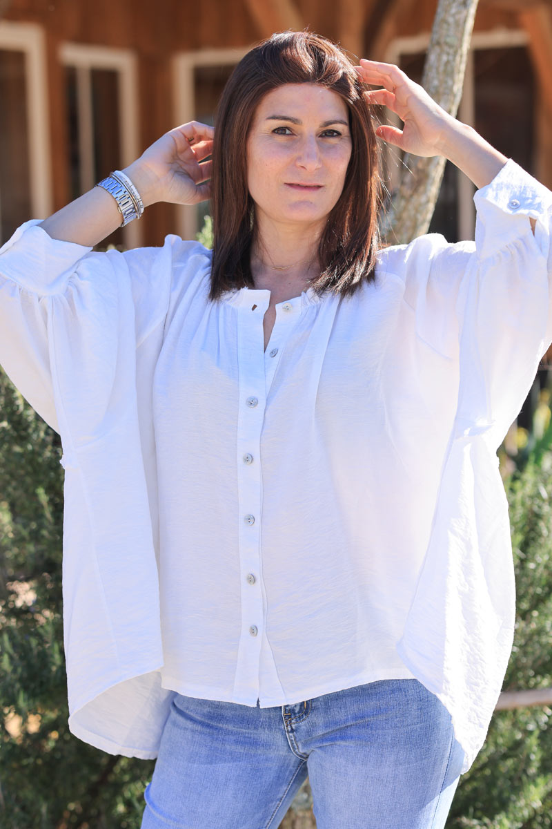 White oversized blouse with frills and batwing sleeves