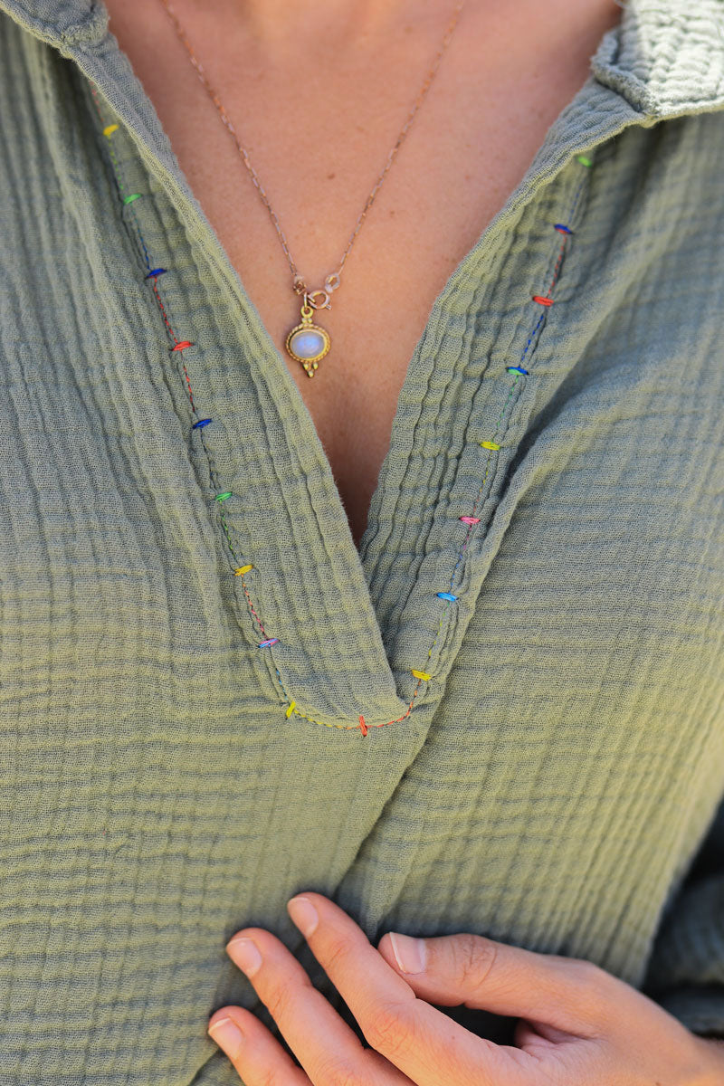 Khaki cotton gauze blouse with colored threads seams detail 
