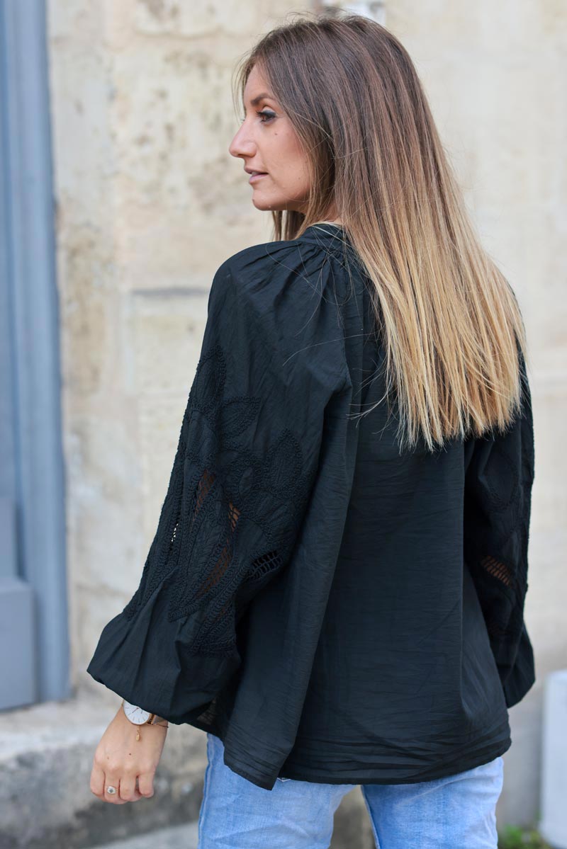 Black blouse with open crochet sleeves