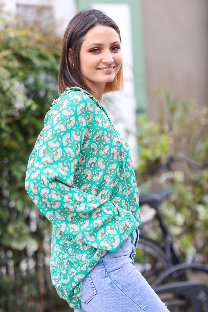 Floaty green blouse with Indian headdress print