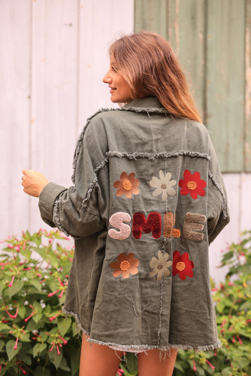 Khaki denim jacket with 'smile' and flower embroidery