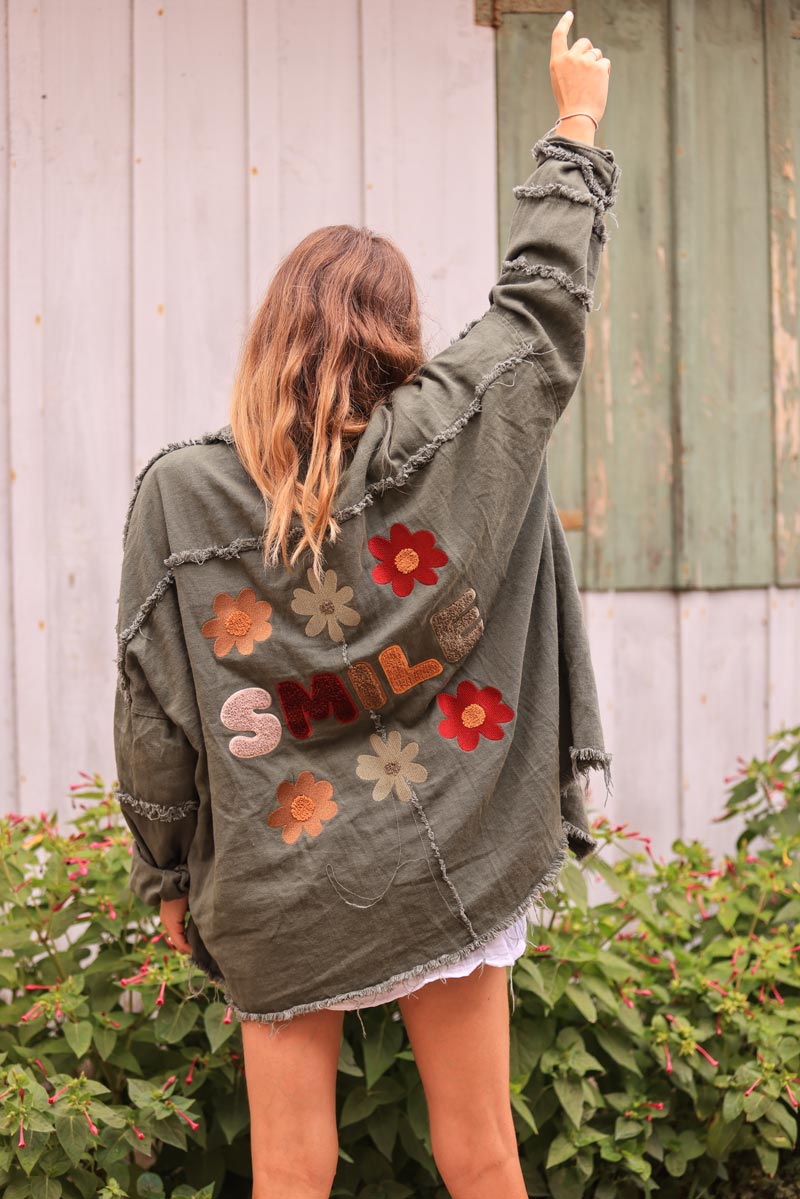 Khaki denim jacket with 'smile' and flower embroidery