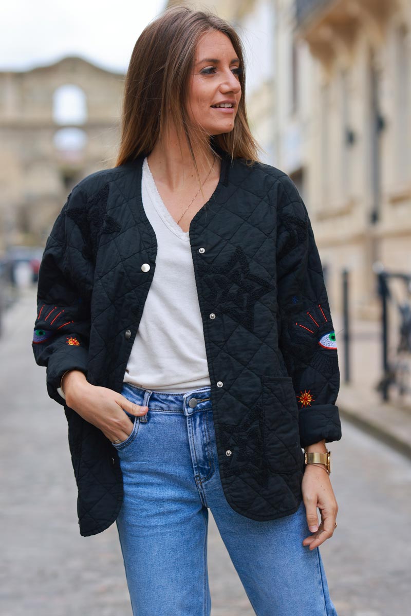 Veste matelassée noire en coton avec boutons et poches broderie étoiles et œil