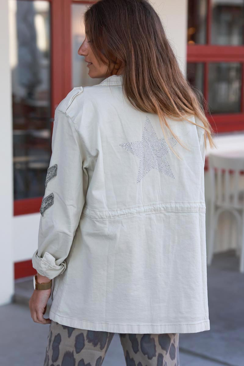 Veste saharienne en toile beige boutons écussons et étoile strass dans le dos