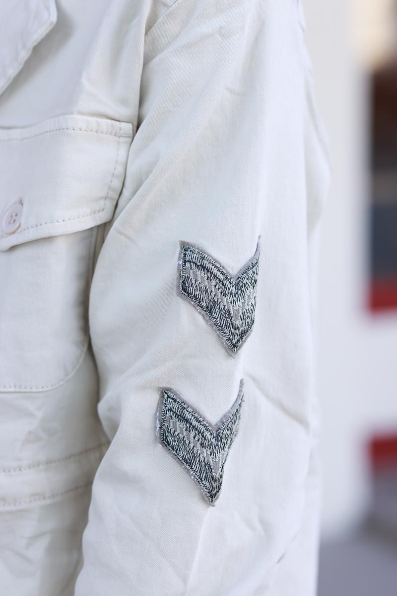 Veste saharienne en toile beige boutons écussons et étoile strass dans le dos