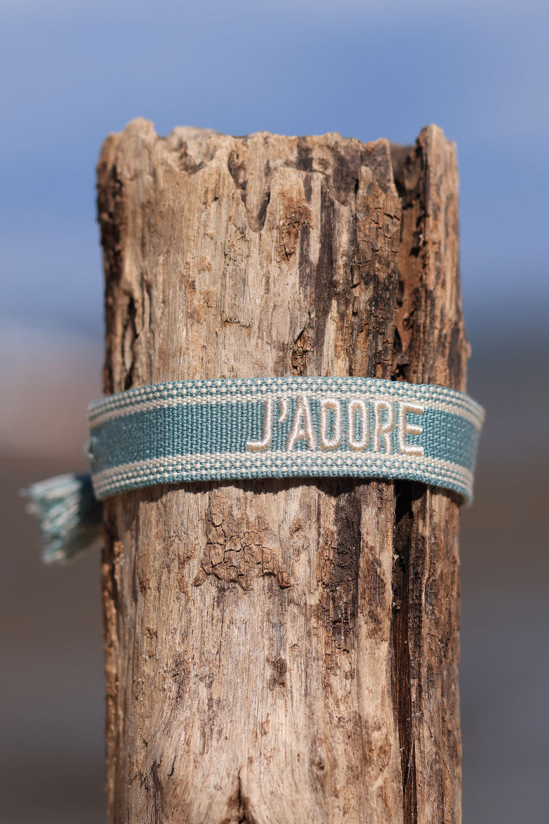 Turquoise fabric bracelet with ecru 'J'adore' embroidery 