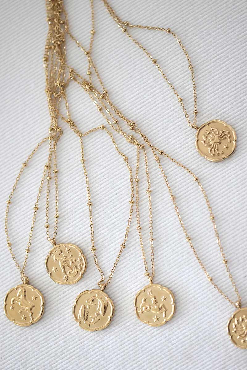 Gold necklace with taurus zodiac pendant