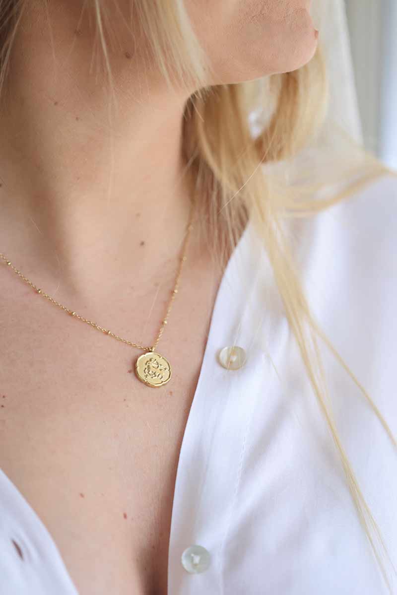 Gold necklace with sagittarius zodiac pendant
